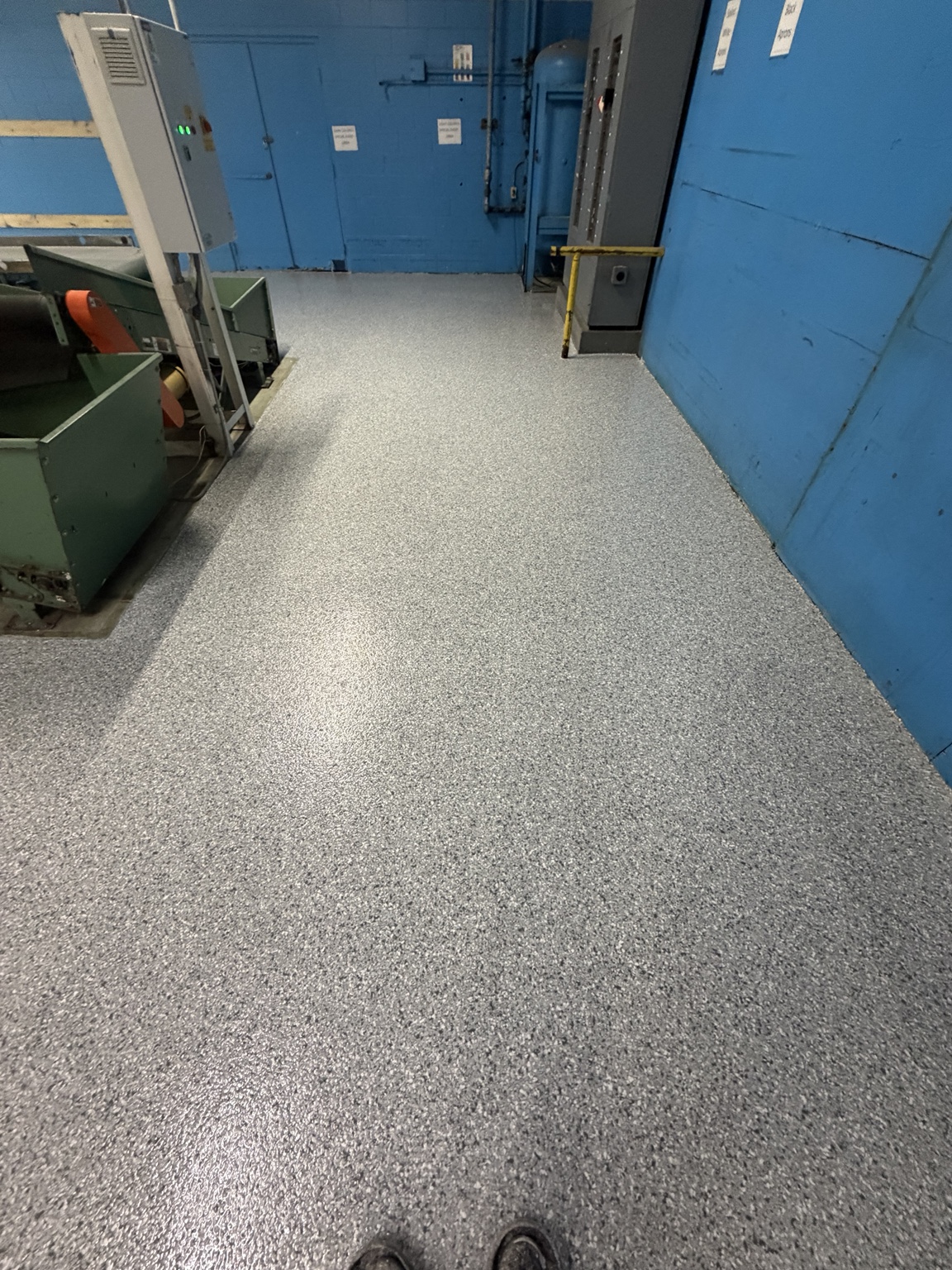 Commercial flake floor coating installed around industrial equipment