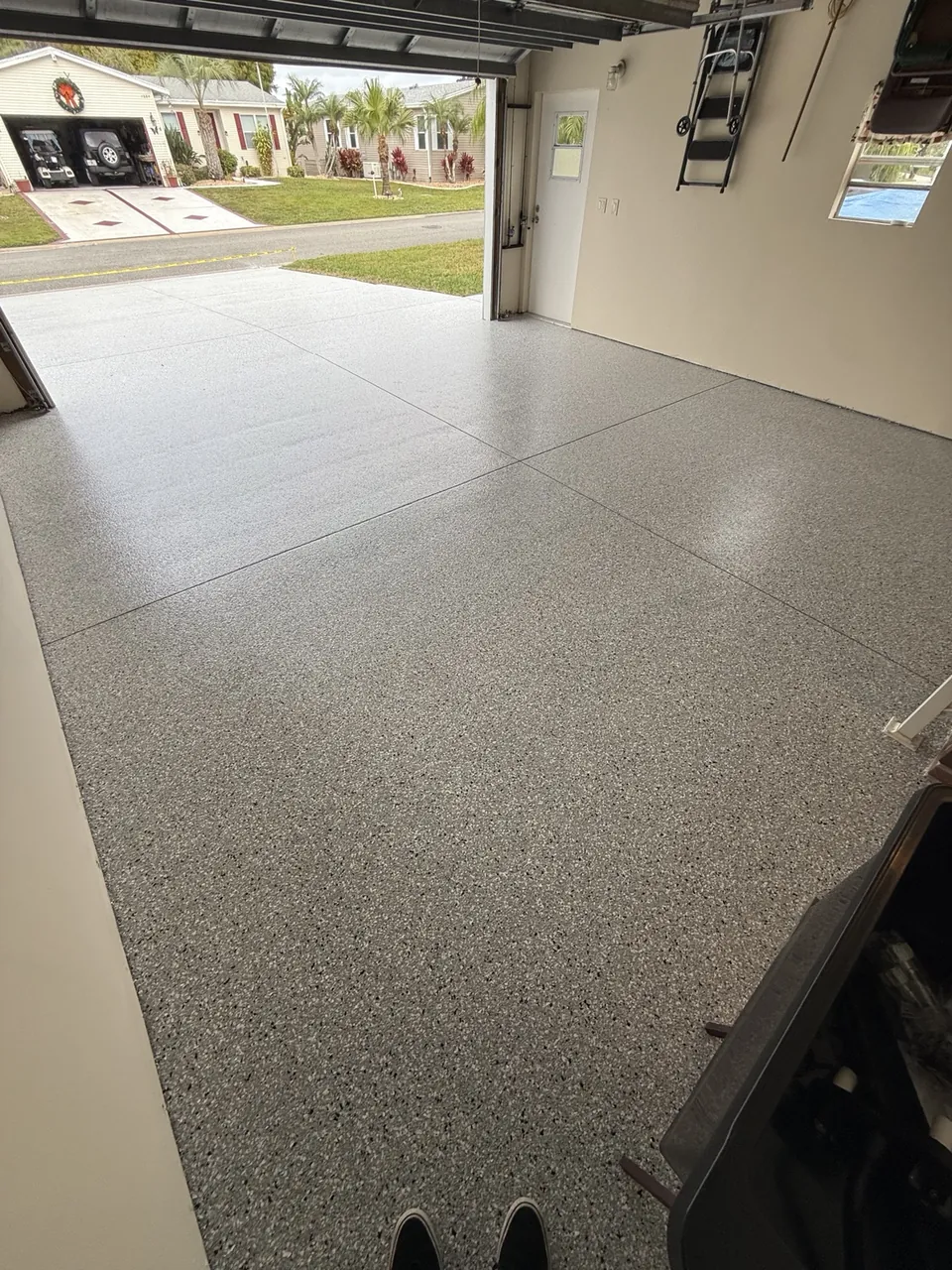 Matching coated driveway viewed from inside the garage