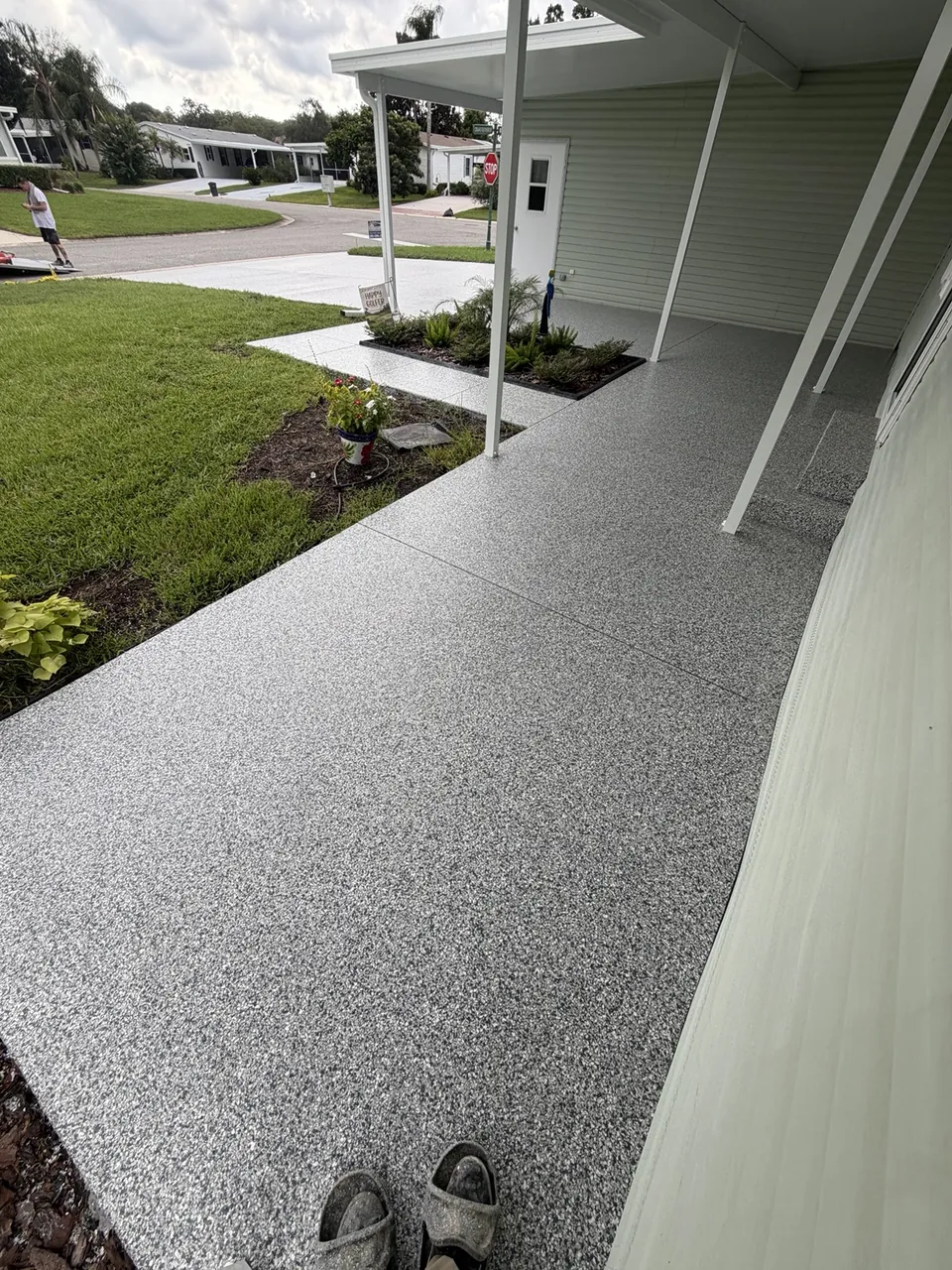 Decorative driveway and entry walkway coating at a home