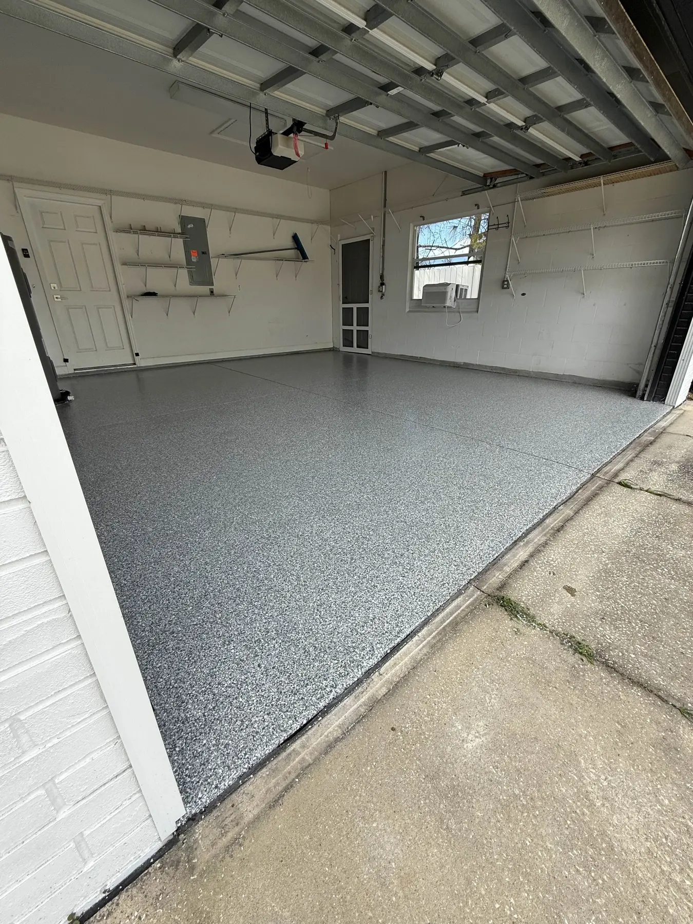 Finished polyaspartic garage floor with professional concrete preparation