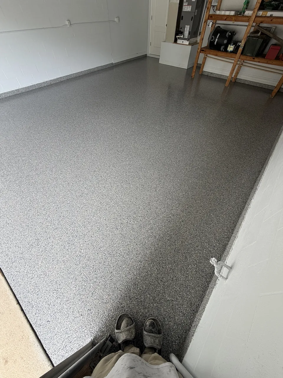 Light gray flake coating in a clean residential garage