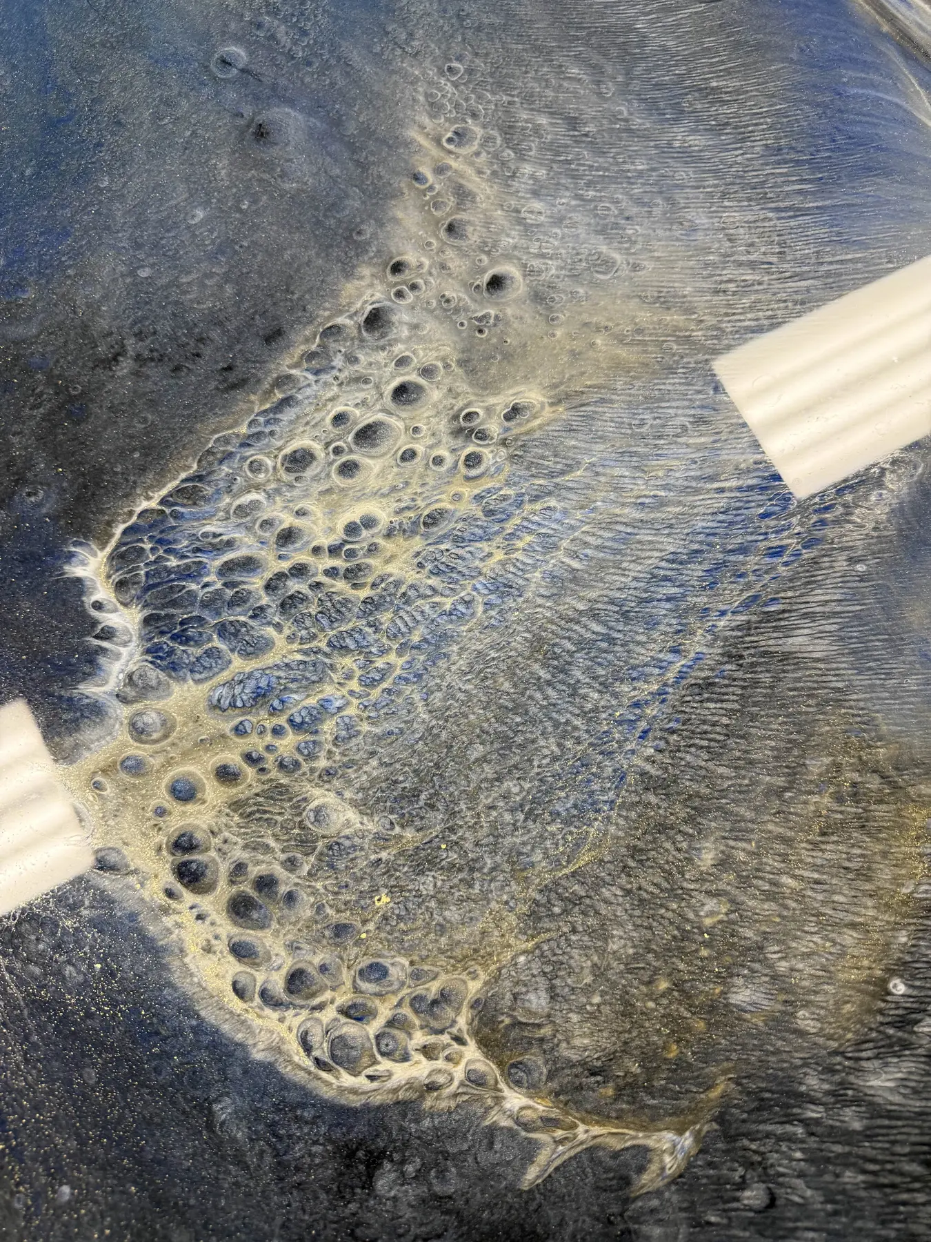 Custom metallic epoxy floor with flowing color and depth